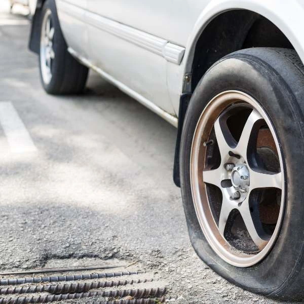 Flat tire being replaced by our expert technicians.