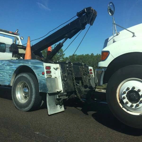 Professional Heavy Duty towing team assisting a stranded vehicle.